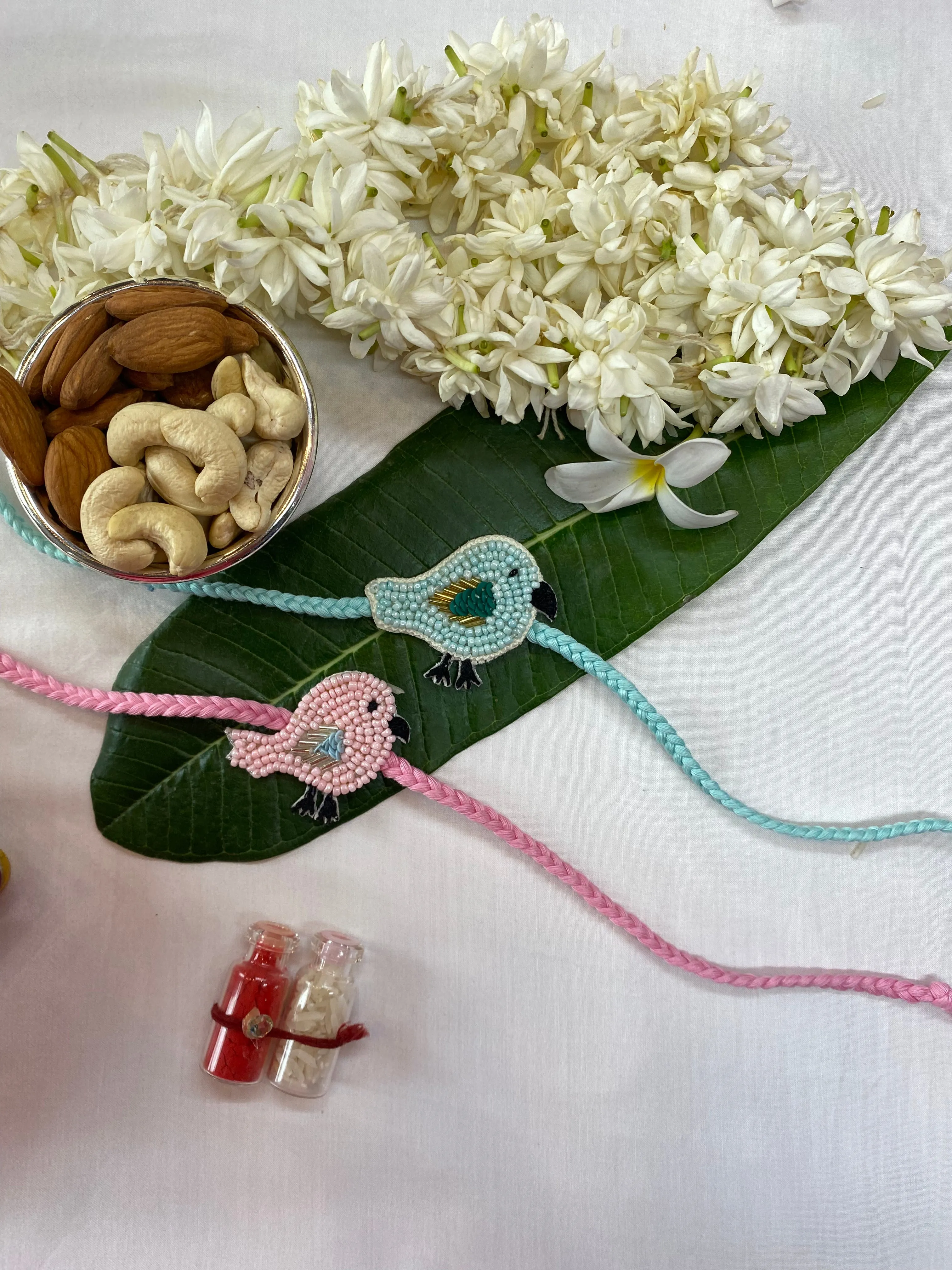 Bird Pair blue and pink Embroidered Rakhi  set of 2