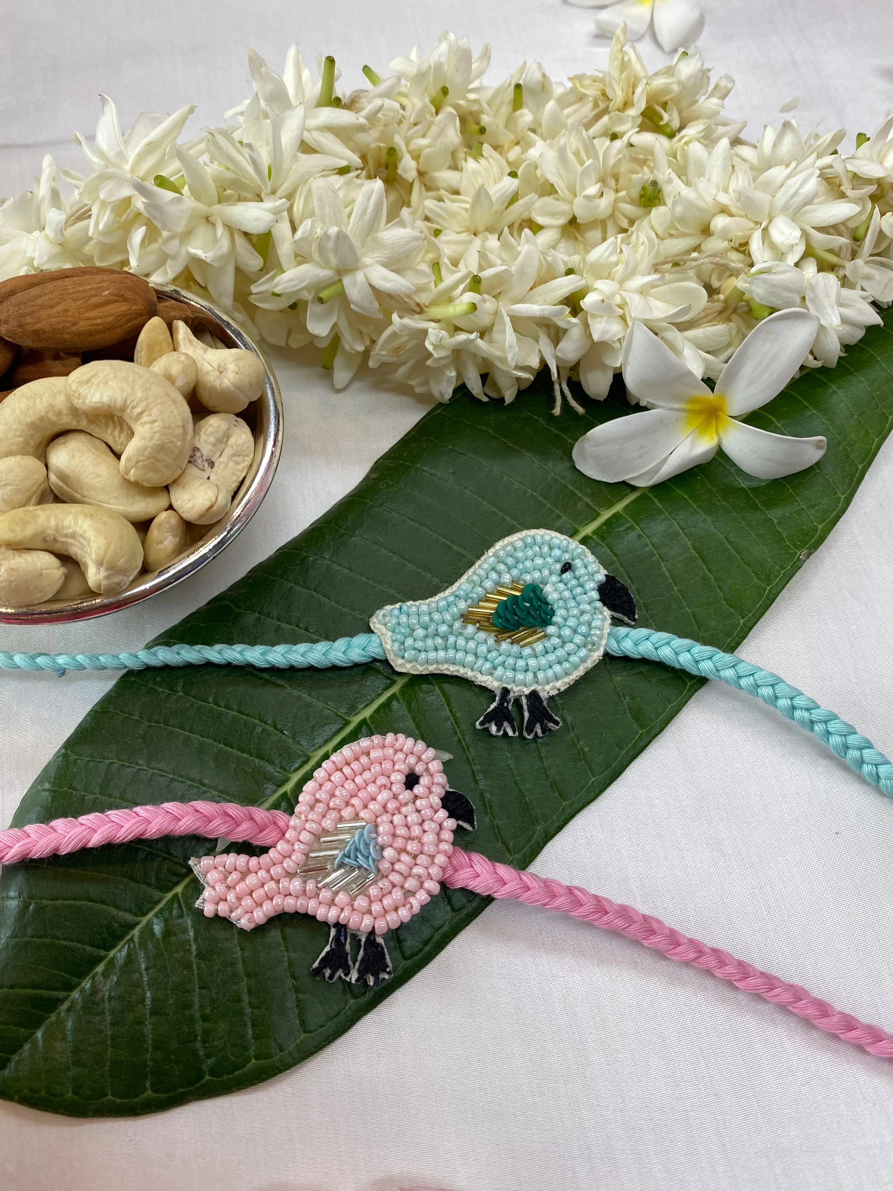 Bird Pair blue and pink Embroidered Rakhi  set of 2