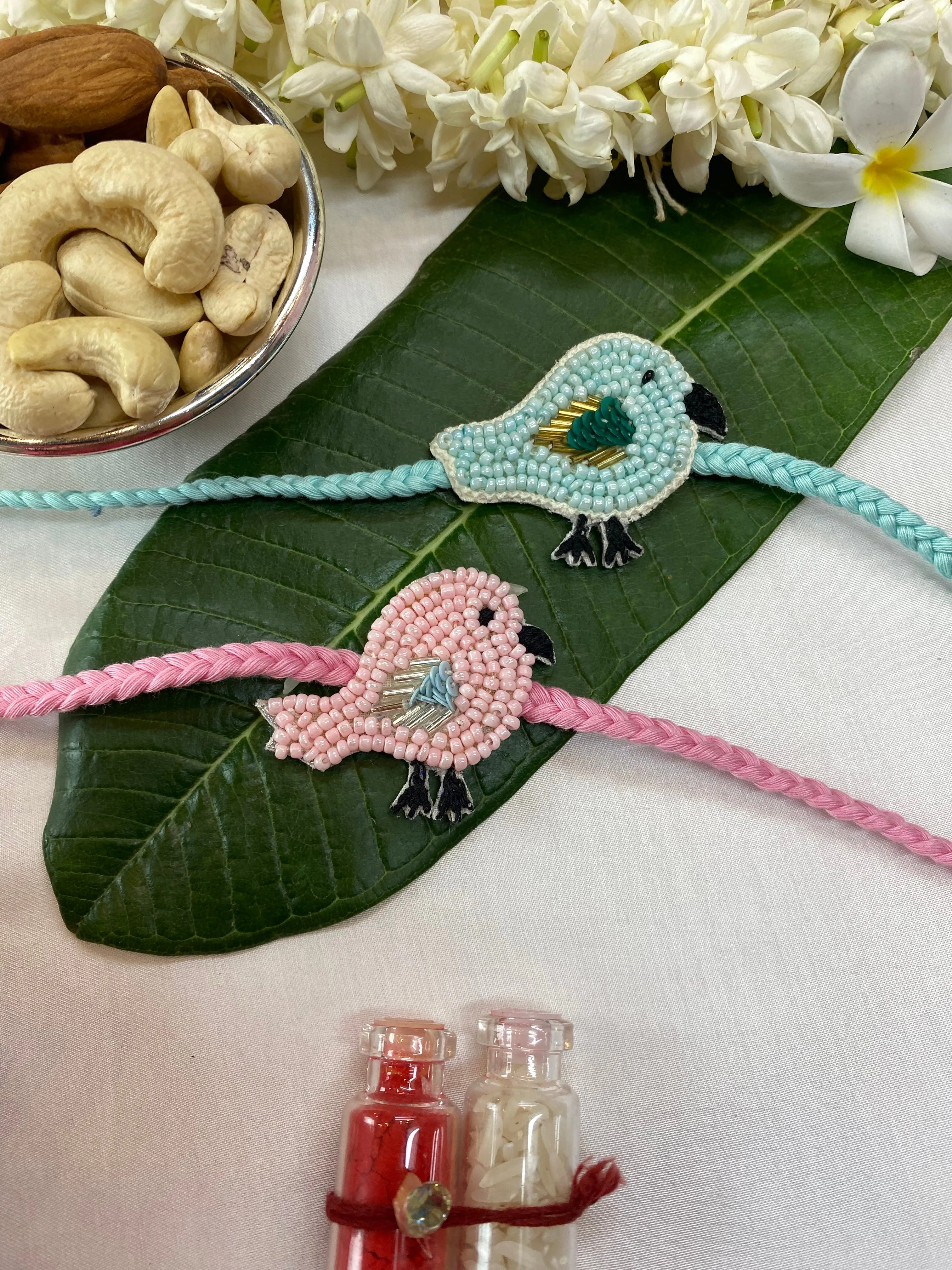 Bird Pair blue and pink Embroidered Rakhi  set of 2