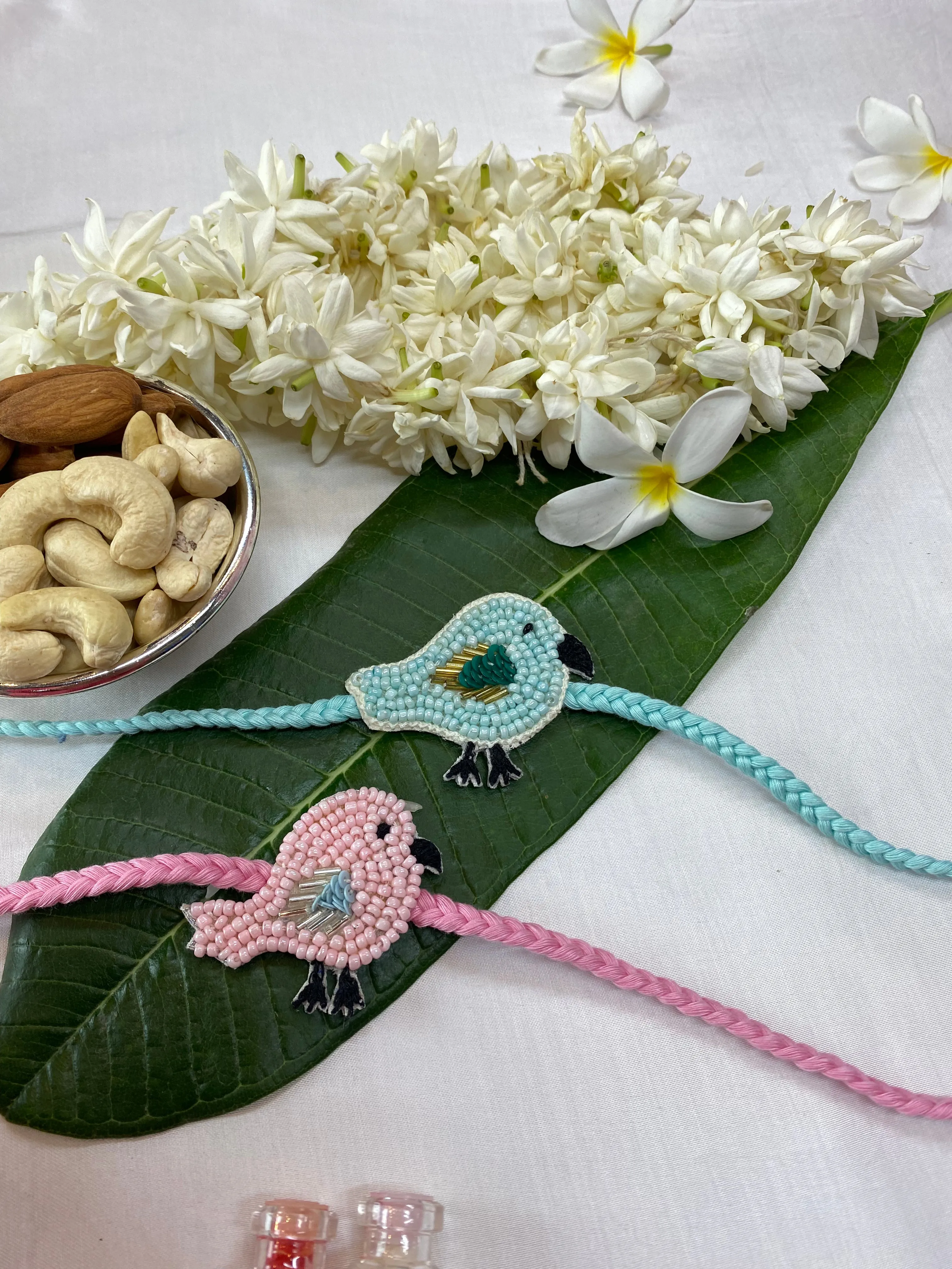 Bird Pair blue and pink Embroidered Rakhi  set of 2